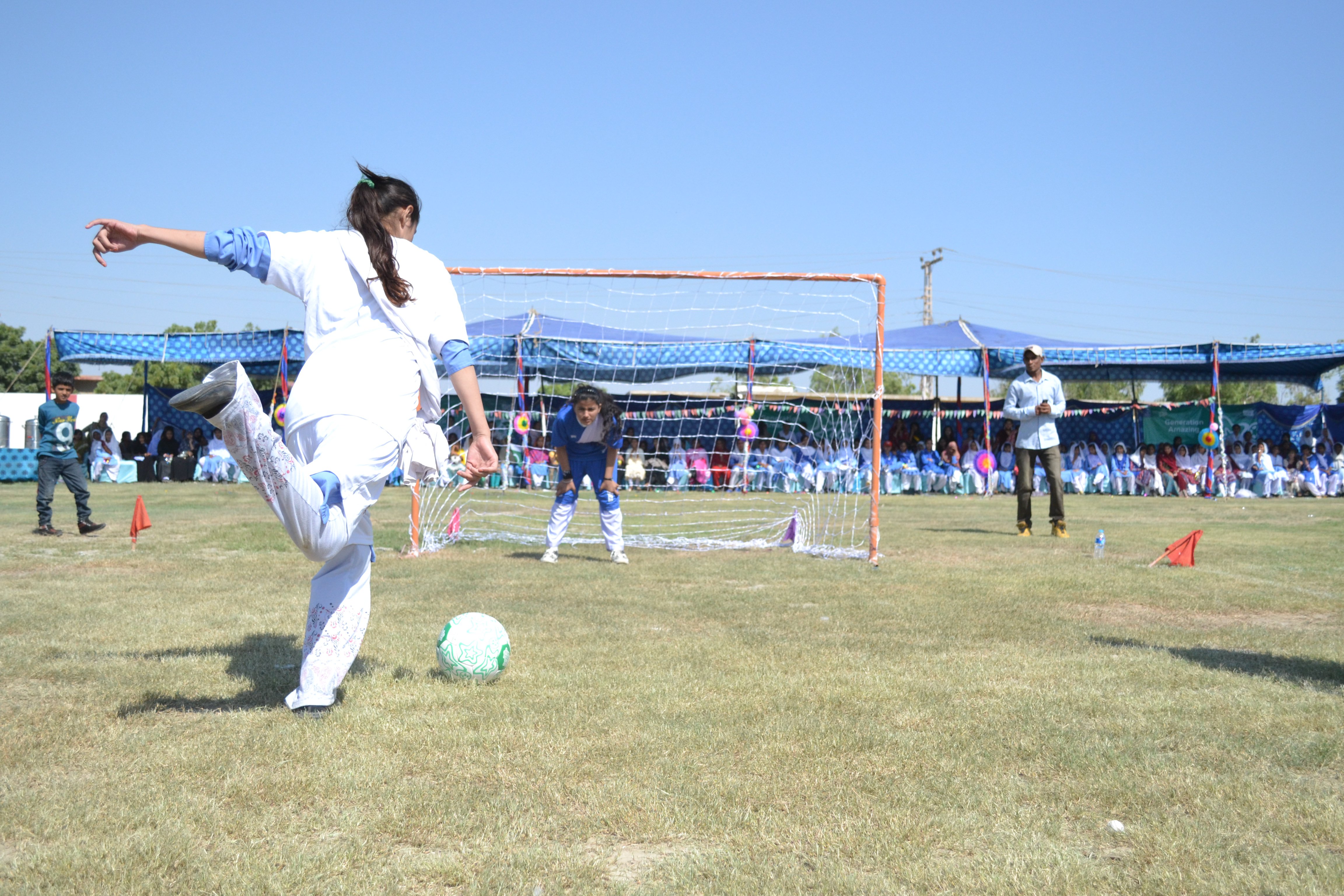 Photo of girl playing football in Pakistan